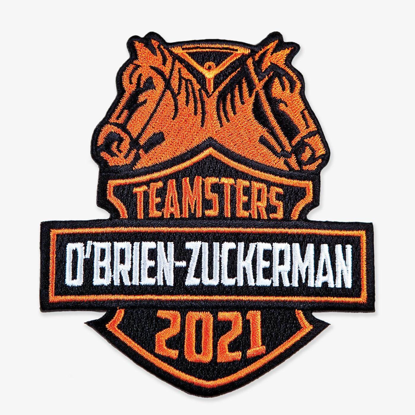 Logo with two horse heads and 'Teamsters O'Brien-Zuckerman 2021' text.